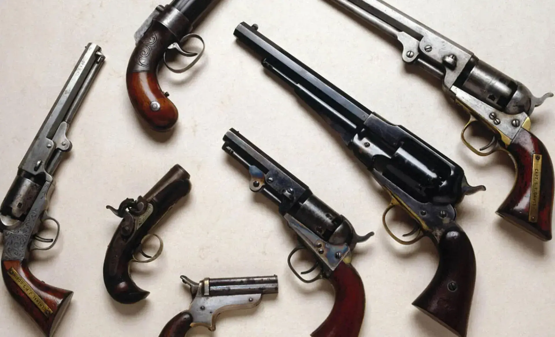 Antique revolvers and derringer pistols for sale at Fat Pocket Pawn