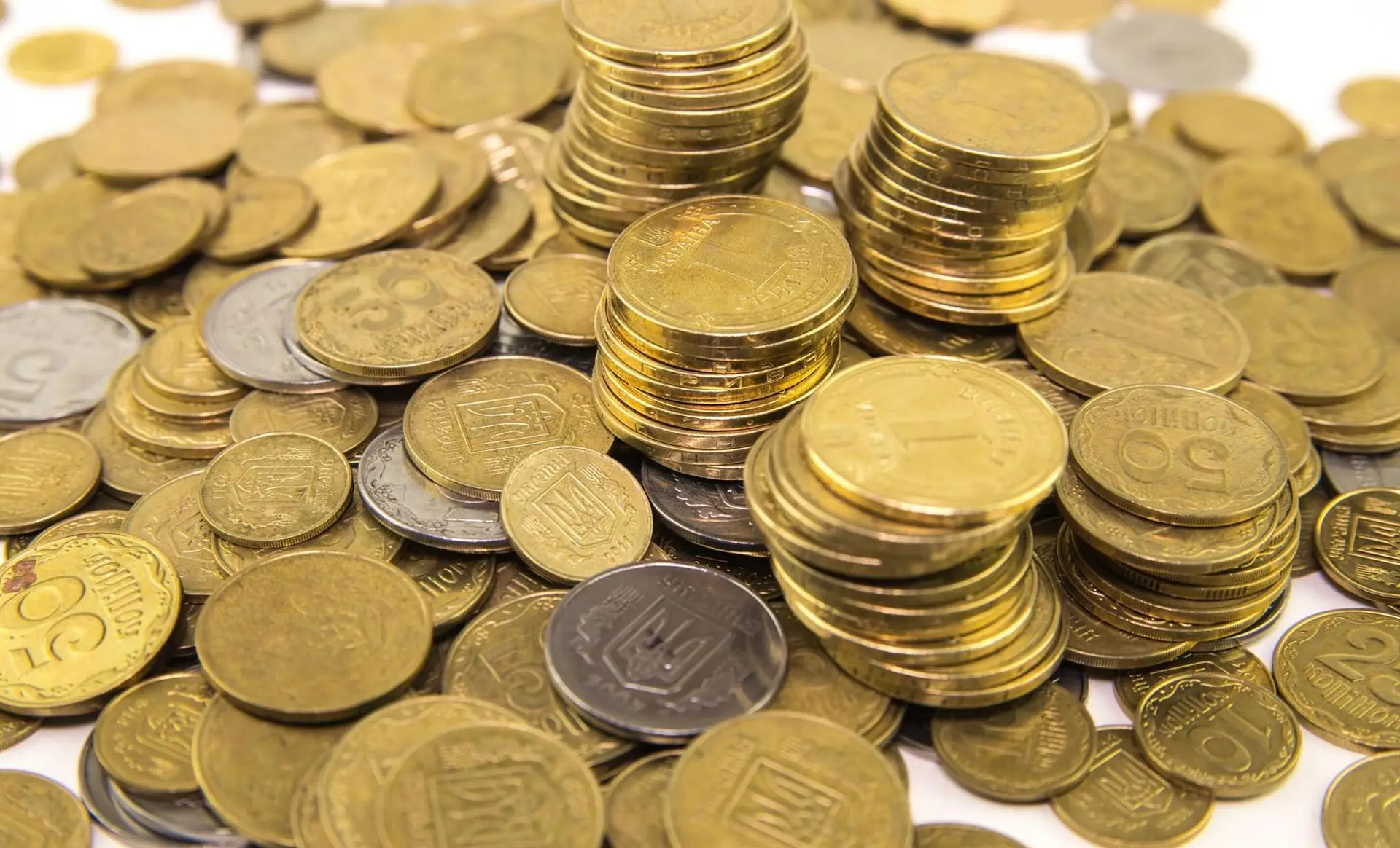 Piles and stacks of gold-colored coins